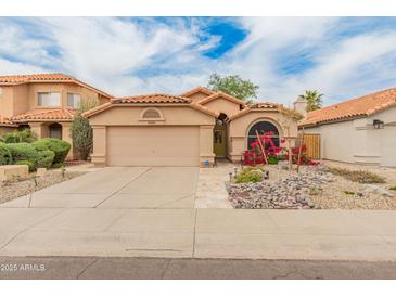 Charming single-Gathering home with a well-manicured yard and inviting curb appeal at 18886 N 77Th Ave, Glendale, AZ 85308
