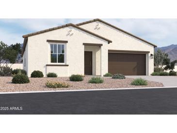 Charming single-story home featuring a stucco facade, a two-car garage, and desert landscaping at 24091 W Bowker St, Buckeye, AZ 85326