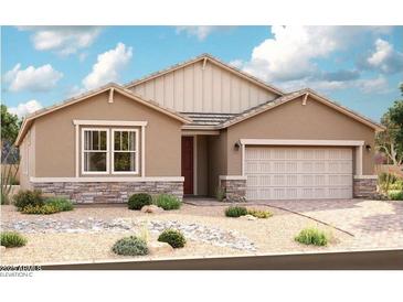 Charming single-story home featuring stone accents, a two-car garage, and a low-maintenance desert landscape at 40499 W Michaels Dr, Maricopa, AZ 85138