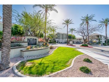 Welcoming entrance to community featuring lush landscaping and clear signage at 5303 N 7Th St # 109, Phoenix, AZ 85014