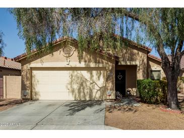 Charming single-Gathering home featuring a two-car garage and cozy front porch at 8520 E Laguna Azul Ave, Mesa, AZ 85209