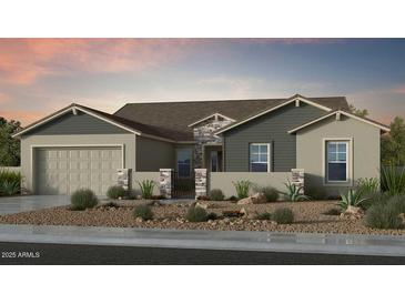 Charming single-story home with stone accents, neutral paint, desert landscaping, and an attached two-car garage at 18868 E Celtic Manor Dr, Queen Creek, AZ 85142