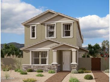Charming two-story home with stone accents and a well-manicured front yard at 1978 W Lariat Ln, Phoenix, AZ 85085
