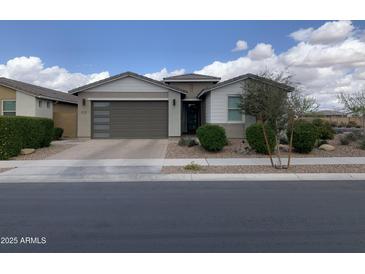 Charming single-story home with a desert-style landscaped front yard and a two-car garage at 22568 E Rosa Rd, Queen Creek, AZ 85142