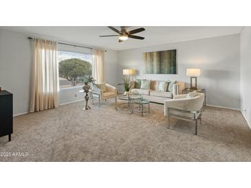 Inviting living room featuring stylish seating arrangements, decorative wall art, and natural light at 6217 E El Paso St, Mesa, AZ 85205