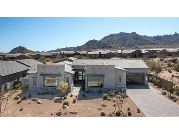 Stunning single-story home with desert landscaping, mountain views and paver driveway in a gated community at 13319 E Juan Tabo Rd, Scottsdale, AZ 85255