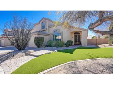 Charming home featuring an inviting walkway, mature landscaping, and a verdant lawn at 4235 W Harrison St, Chandler, AZ 85226