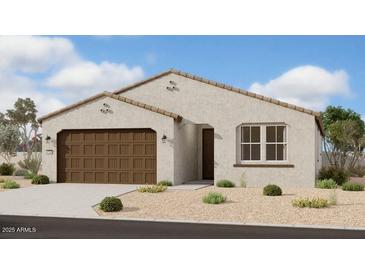 Charming single-story home featuring a two-car garage and low-maintenance desert landscaping at 5628 W Summerside Rd, Laveen, AZ 85339