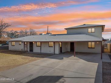 Charming two-story home features a spacious driveway and covered parking at 1153 E 12Th St, Casa Grande, AZ 85122