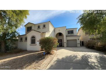 Stunning two-story home featuring a well-manicured front yard and convenient driveway at 1167 W Dana Dr, San Tan Valley, AZ 85143