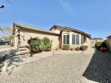 Charming single-story home featuring a desert landscape, a bay window, and an inviting walkway to the front door at 18151 N 88Th Dr, Peoria, AZ 85382