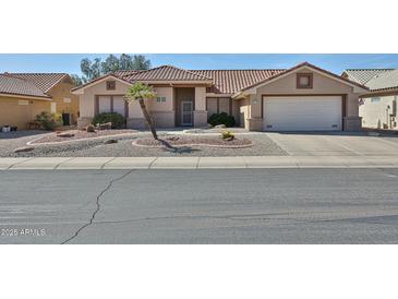 Charming single-story home with desert landscaping, barrel tile roof and two-car garage at 23106 N 146Th Ln, Sun City West, AZ 85375