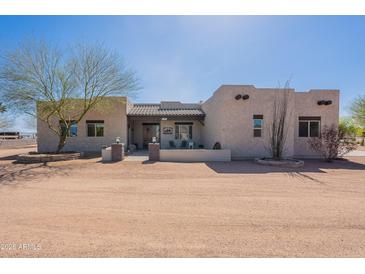 Charming single-story home featuring desert landscaping and a quaint covered front porch at 2349 W Skyline Ln, San Tan Valley, AZ 85144