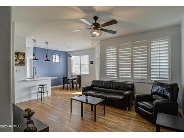 Bright living room with hardwood floors, stylish furnishings, and a modern ceiling fan at 3302 N 7Th St # 364, Phoenix, AZ 85014