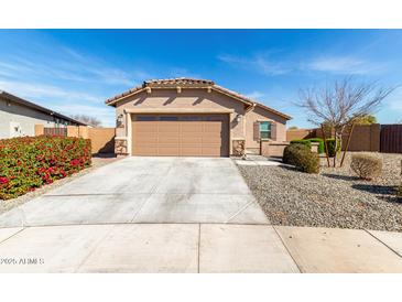 Charming single-story home featuring a well-maintained front yard and a two-car garage at 2204 W Minton St, Phoenix, AZ 85041