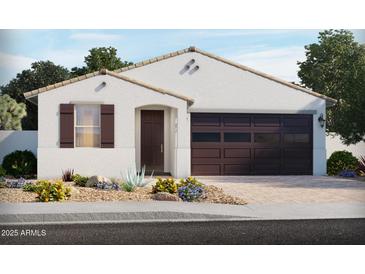 Charming single-story home featuring a stucco exterior, tile roof, and a two-car garage at 24618 W Bowker St, Buckeye, AZ 85326