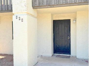 Inviting front entryway featuring a secure black security door for added peace of mind at 2121 W Union Hills Dr # 104, Phoenix, AZ 85027