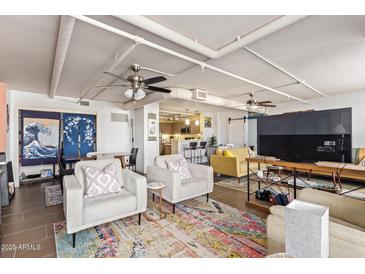 Bright and open living room featuring modern furnishings and colorful rug at 535 W Thomas Rd # 313, Phoenix, AZ 85013