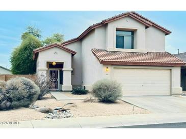 Charming two-story home with desert landscaping and a two-car garage at 17059 W Northampton Rd, Surprise, AZ 85374
