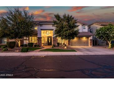 Elegant two-story home with meticulously landscaped front yard, stone accents, and a convenient two-car garage at 2484 E Lodgepole Dr, Gilbert, AZ 85298