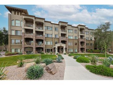 Beautiful exterior with manicured landscaping, stone accents, and inviting entrance to the condos at 5350 E Deer Valley Dr # 2236, Phoenix, AZ 85054