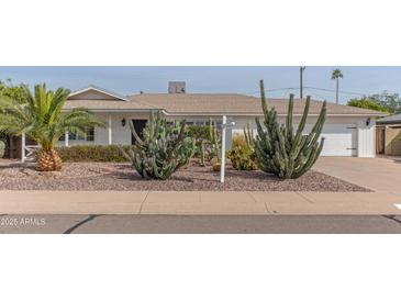 Charming home featuring desert landscaping, a well-maintained yard, and a classic exterior at 6702 E Monte Vista Rd, Scottsdale, AZ 85257