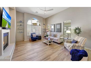 Bright living room featuring tile flooring, large windows and comfortable seating arrangements at 20802 N Grayhawk Dr # 1017, Scottsdale, AZ 85255