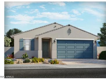 Charming single-story home boasts a two-car garage, xeriscaped front yard, and stylish neutral paint at 24383 W La Salle St, Buckeye, AZ 85326