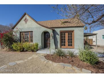 Charming home featuring a quaint front yard, unique architectural details, and inviting curb appeal at 2538 N 8Th St, Phoenix, AZ 85006