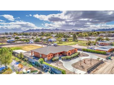 Spacious property with a well-maintained home, mature trees, and mountain views in a peaceful neighborhood at 25903 S Lemon Ave, Queen Creek, AZ 85142