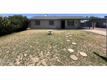 Charming single-story home with a desert front yard and quaint stepping stones, providing curb appeal at 1210 E Marny Rd, Tempe, AZ 85288