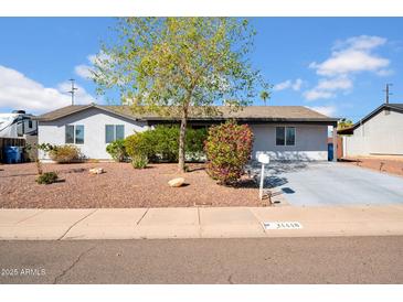 Charming single story home with mature landscaping and a well maintained front yard at 14446 N 40Th Pl, Phoenix, AZ 85032