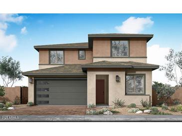 Beautiful two-story home with modern architectural details and a well-manicured front yard at 40250 N Alegre Dr, San Tan Valley, AZ 85140