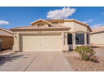 Charming single-Gathering home featuring a two-car garage and well-maintained landscaping at 6718 E Northridge St, Mesa, AZ 85215