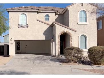 Stunning two-story home with a neutral stucco exterior and an open two-car garage at 6819 S 38Th Dr, Phoenix, AZ 85041