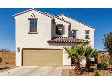 Charming two-story home featuring a neutral color scheme and a spacious two-car garage at 375 S Soledad Ln, Casa Grande, AZ 85194