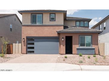 Charming two-story home with a modern garage door and neutral color palette at 40234 N Alegre Dr, San Tan Valley, AZ 85140