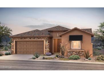 Charming single-story home featuring a stone facade, tile roof, two-car garage, and professionally landscaped yard at 7723 W Cactus Wren Way, Florence, AZ 85132