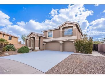 Beautiful two-story home with a three-car garage and well-maintained landscaping at 1473 E Mead Dr, Chandler, AZ 85249