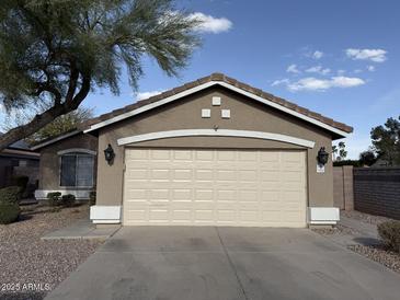 Charming single-story home featuring a large two car garage and desert landscaping at 1605 N Serina --, Mesa, AZ 85205