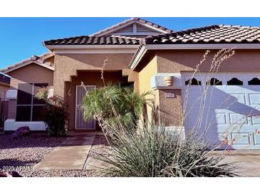 Charming single-Gathering home featuring a well-maintained front yard and a two-car garage at 2509 E Paraiso Dr, Phoenix, AZ 85024