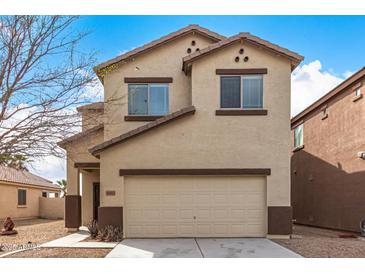 Charming two-story home with a neutral color palette and a convenient attached two-car garage at 35973 W Velazquez Dr, Maricopa, AZ 85138