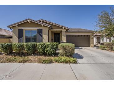 Charming single-story home with a well-maintained front yard and a two-car garage at 5360 S 98Th Pl, Mesa, AZ 85212