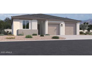 Charming single-story home featuring a two-car garage, neutral color palette, and low maintenance front yard at 11818 N Vanero Ct, Maricopa, AZ 85139