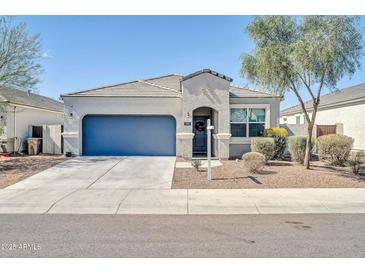 Charming single-story home with a well-maintained front yard and a two-car garage at 214 N 190Th Dr, Buckeye, AZ 85326