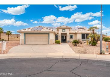 Charming single-story home featuring a two-car garage, desert landscaping, and a new solar panel system at 23219 N 145Th Dr, Sun City West, AZ 85375