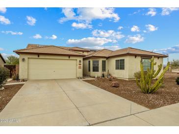 Charming home with a well-manicured yard and a spacious two-car garage, offering both convenience and curb appeal at 25320 W Heathermoor Dr, Buckeye, AZ 85326