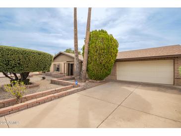 Charming single-Gathering home boasting a well-maintained yard and a spacious two-car garage at 4701 E Voltaire Ave, Phoenix, AZ 85032