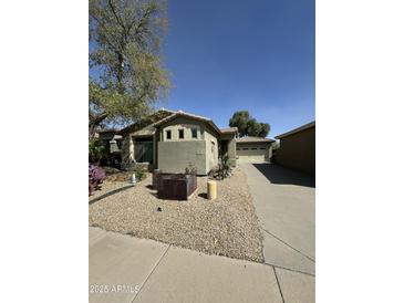 Charming single-story home with desert landscaping and a cozy front patio at 5145 S Eileen Dr, Chandler, AZ 85248