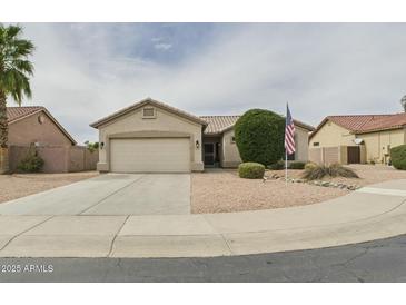 Charming single-story home featuring a two-car garage and low-maintenance desert landscaping at 6050 S Crosscreek Ct, Chandler, AZ 85249